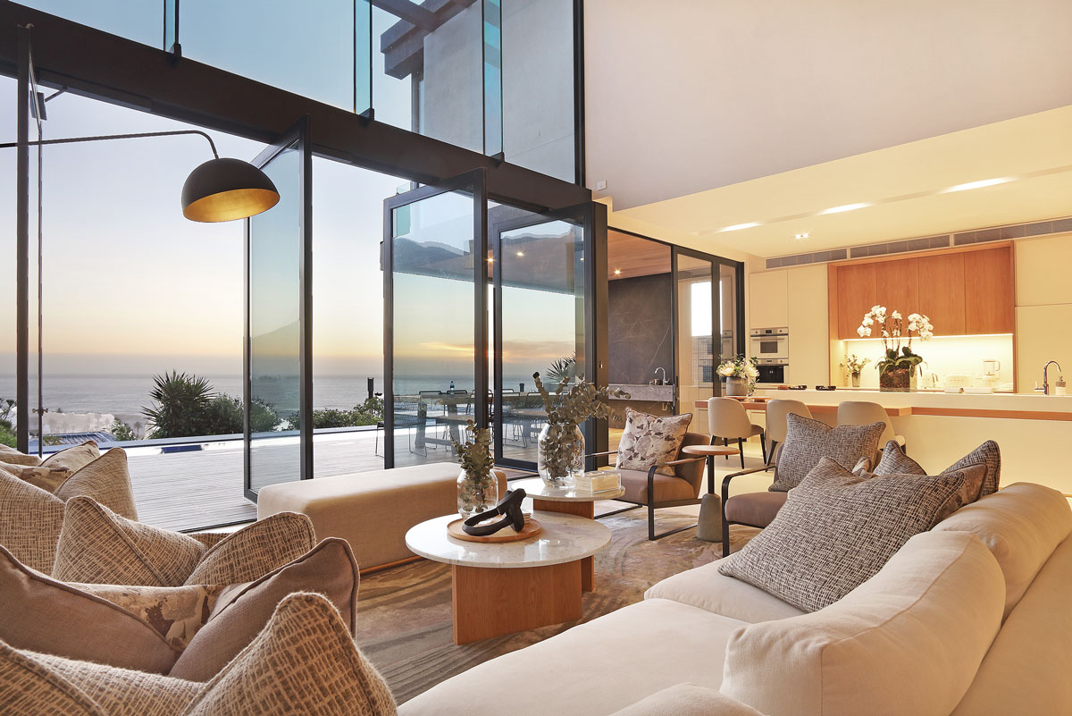 Luxury Camps Bay villa living area at sunset